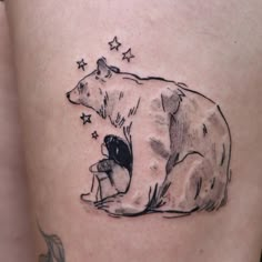 a black and white drawing of a bear with stars on it's back leg