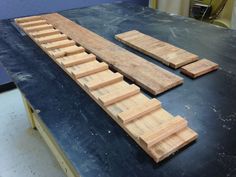 several pieces of wood sitting on top of a table