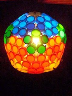 a colorful lamp that is on top of a table