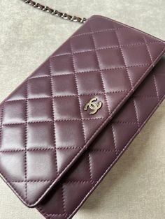 Overview Chanel Wallet on Chain in Aaubergine Lambskin Leather with Dark Silver Hardware. The ultimate evening style, the classic Chanel WOC is timeless and features the CC hardware detailing on the front flap. Lambskin leather is luxurious and soft in texture. Perfect for evening wear or night out to carry the essentials. Can be carried as a handheld clutch with the chain tucked inside, or over shoulder or cross body. Lovely dark purple shade. Features Aubergine Lambskin Leather Silver toned ha Dark Purple Shade, Chanel Wallet On Chain, Chanel Woc, Classic Chanel, Evening Style, Chanel Wallet, Wallet On Chain, Hermes Bags, Leather Silver