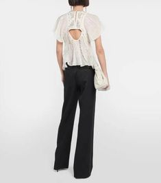 Embrace Isabel Marant's bohemian attitude with the Orna top. Made from airy silk-blend chiffon and threaded with metallic fibers, it's adorned with delicate embroidery and features cutouts at the front and back..Lining: 100% cotton.Material: 16% metallic fibres, 84% silk.Details: 100% brass.Designer color name: White.Care instructions: dry clean.Made in India.Embroidery: 100% polyester.True to size.Low back.Semi-sheer.Designed for a loose fit.Lightweight material.Slightly cropped.The model seen Embroidered Chiffon, Delicate Embroidery, Wool Pants, Top Collection, Chiffon Top, Low Back, Women's Tops, Chiffon Tops, Isabel Marant