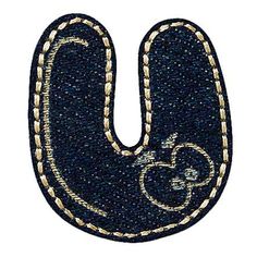 the letter u is made out of denim and has gold stitching on it's edges