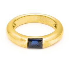 Binenbaum Antiques & Jewelry - Crafted from radiant 18-carat yellow gold, this ring balances classic charm with modern sophistication. A mesmerizing 0.47-carat step-cut sapphire, in a deep blue hue, rests securely in a bezel-style open setting, maximizing brilliance. The smooth, slightly domed band, measuring approximately 4.5 mm at its widest point, offers understated elegance perfect for everyday wear or special moments.