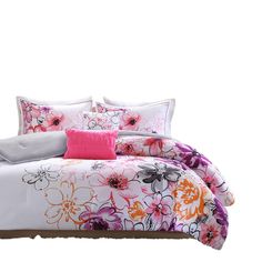 an image of a bed with pink and orange floral comforter set on top of it