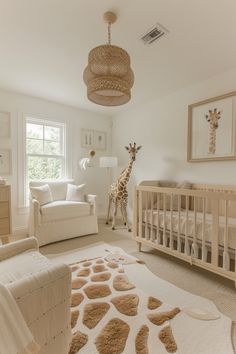 a baby's room with a giraffe in the background