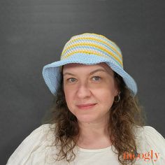 a woman wearing a blue and yellow hat