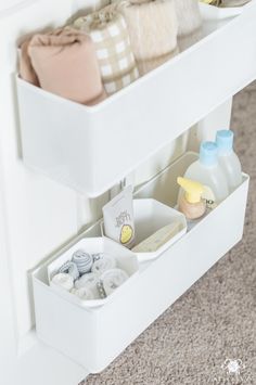 an open drawer with baby items in it