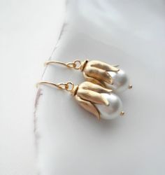 White Pearl Gold Drop Earrings Wedding Jewelry by AnechkasJewelry Nickel-free Gold Pearl Earrings For Wedding, White Brass Pearl Earrings For Wedding, Vintage White Bridal Earrings As Gift, White Vintage Bridal Earrings As Gift, Nickel-free Gold Flower Earrings For Wedding, Vintage White Bridal Earrings For Gift, Vintage White Bridal Earrings, White Vintage Bridal Earrings, Elegant Brass Flower Earrings For Wedding