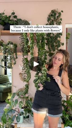 a woman standing in front of a potted plant with the caption'there is no place like home, because i only like plants with flowers '