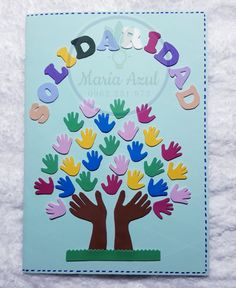 a handprinted card with the words daddy and two hands in front of a tree