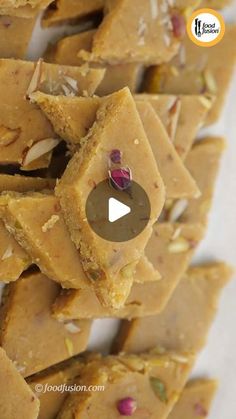 a pile of peanut butter fudges stacked on top of each other with a video in the middle