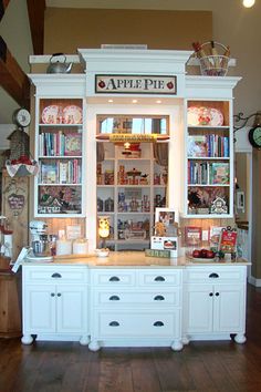 an apple pie shop with lots of books on the front and shelves full of treats