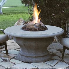 a fire pit sitting on top of a stone patio