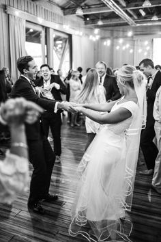 a bride and groom dancing at their wedding reception