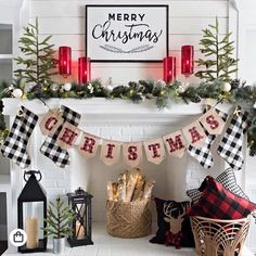 a fireplace decorated for christmas with stockings and candles