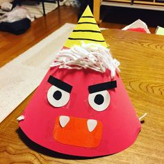 an angry bird hat sitting on top of a wooden table