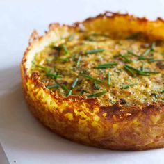 a quiche with cheese and herbs on top