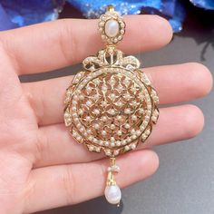 Featuring a beautiful pearl pendant set in 22ct gold. It has been embellished with precious pearls. This timeless piece of jewelry will never go out of style, allowing you to cherish its beauty for years to come. It weighs 15.39 GMs including 0.82 GMs of hanging pearls Price Breakup Summary Component Rupees % of Total 22k Gold 74,910 77.5% Stones & Beads 5,471 5.7% Making Charges 13,484 13.9% Taxes (GST) 2,816 2.9% Total 96,681 100.0% View Detailed Price Breakup Here Elegant 22k Gold Pearl Pendant, Gold-plated Pearl Pendant Earrings For Wedding, Gold Plated Pearl Pendant Earrings For Wedding, Gold Kundan Pearl Pendant Necklace, Elegant Gold Plated Jewelry For Eid, Elegant Gold-plated Jewelry For Eid, Formal Gold Chandbali Pearl Necklace, 22k Yellow Gold Jewelry With Pearl Pendant, Wedding Pearl Pendant Earrings In Yellow Gold