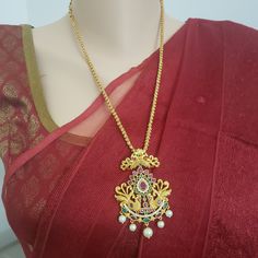 "Handmade Indian Temple Jewelry, best to wear it for traditional ceremonies or Indian wedding. This bridal jewelry has ethnic finish. It has Cubic Zircon stones with ruby and emeralds. It is a Bollywood style one gram jewelry. There are long and short patterns of Indian jewelry in Kundan, Pearls, CZ, American Diamond , ruby, emerald, Polki, kemp to suit every occasion of South Indian and North Indian weddings. Handmade Indian Jewelry item * Stunning Hand made matt finish traditional jewelry set. Wedding Temple Necklace With Latkans, Wedding Temple Necklace With Intricate Design, Wedding Long Temple Necklace With Intricate Design, Temple Jewelry Style Bridal Long Necklace, Temple Jewelry Style Bridal Long Necklace For Wedding, Temple Jewelry Style Long Bridal Necklace For Wedding, Traditional Heavy Long Temple Necklace, Traditional Peacock Design Necklace For Ceremonial Use, Heavy Long Temple Necklace