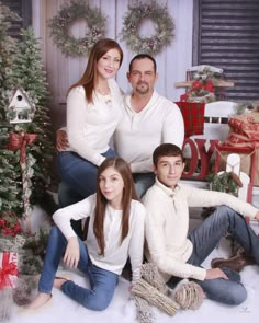 a family posing for a christmas photo