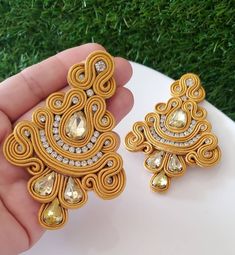 Handmade earrings, unique design of our brand, unique piece, beautiful, casual and formal. Wear them with your outfit day or night. Item details: Size: 3.7 inches long Material: soutache The soutache cord is a rayon cord in the form of a braid that is used to decorate jewelry. It is available in a wide variety of colors and is used by combining a multitude of beads such as pearls, mother-of-pearl, glass, miyuki, strass, natural beads, etc. Our earrings are handmade, exclusive to our brand, each model is unique, they are not repeated. We work with excellent materials, natural stones, gold plated, soutache, tassels, crystals, stainless steel and many more of the best quality. Check all the models that we have available in our web site www.acaccessoriesmiami.etsy.com Follow us on instagram @a Elegant Handmade Yellow Chandelier Earrings, Soutache Tutorial, Earrings Big, Soutache Earrings, Fashion Bohemian, Earrings Unique, Big Earrings, Jewelry Unique, Bohemian Fashion