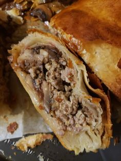 a meat filled pastry is cut in half