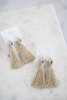 Featured here in metallic platinum, our signature tassel earrings are a lightweight statement drop accented by gold hardware for added sparkle. Tassel earring measures 3" long with 14k gold-plated, nickel-free hardware. Handmade in Charleston, South Carolina.