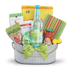 a gift basket with drinks, snacks and condiments in a metal pail