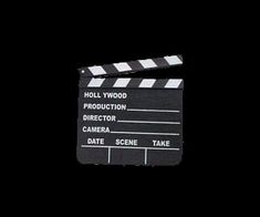 a black and white movie clapper on a black background