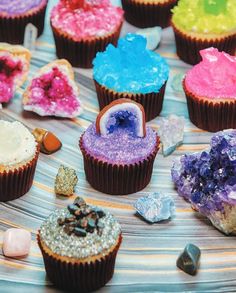 several cupcakes with different colored frosting on them