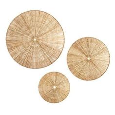 three round straw coasters on a white background