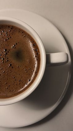 a cup of hot chocolate on a saucer