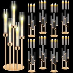 a set of candles that are lit up in different positions and sizes, all with gold bases