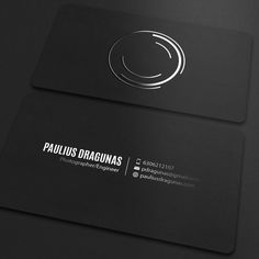 the business card is designed to look like it has a circular logo on it,