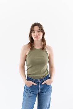 "WW2 Undershirt Tank Top in Olive Green. Low armholes and a flattering neckline. Black faded Letters on back. Material: 100% cotton  |  Made in USA in the 40s. Condition: Good. a few small pin holes - on back..   XSMALL-LONG: Shoulders: 8.5\" | Chest: 14\"  |  Length: 28\" Cassie is 5'8\" and wears a size small top. SHOP http://www.rawsonstudio.etsy.com FOLLOW US + instagram | @_rawson + pinterest | rawson *No Returns. Items are eligible for store credit only. We ask that the buyer ship to provi Olive Green Tank Top, Undershirt Tank Top, Green Tank Top, Small Pin, Green Tank, Fade To Black, Style Expert, Small Tops, Piece Of Clothing