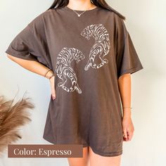 Roar into style with our Comfort Colors Vintage Tiger Shirt! This cute and easy tiger shirt is the perfect addition to your wardrobe. With its boho-inspired design and aesthetic appeal, it's a great gift for her or anyone who loves tigers. Embrace your wild side and stand out with this trendy tiger shirt that will surely turn heads. Whether you're heading out for a casual day or making a bold fashion statement, this vintage tiger shirt is a must-have in your collection! All clothing and accessor Tiger Print Short Sleeve T-shirt For Summer, Short Sleeve Tiger Print T-shirt For Summer, Black Tiger Print Crew Neck Top, Black Crew Neck Top With Tiger Print, Tiger Print Crew Neck Graphic Tee, Cotton Graphic Tee With Tiger Print, Casual Cotton T-shirt With Tiger Print, Casual Cotton Tiger Print T-shirt, Casual Tiger Print Tops For Spring