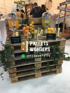 pallets with lemons, oranges and other fruit on display