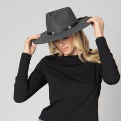 Crafted from luxurious faux felt, this charcoal fedora exudes sophistication and style. Adorned with a silver concho band and tassle ties, it adds a touch of elegance to any outfit. The brim measures 3.75 inches. Available in size 57cm. Features: Color: Charcoal Material: 100% Polyester Size: 57cm Faux Felt Fedora Silver Concho Band with Tassle Ties Brim Size: 3.75" Adjustable Felt Hat For Fall Parties, Gray Brimmed Fedora For Fall, Western Style Fedora For Fall Party, Western Fedora For Fall Party, Gray Adjustable Felt Hat For Fall, Adjustable Gray Felt Hat For Fall, Gray Fedora For Fall, Fall Gray Fedora Hat, Gray Wide Brim Felt Hat For Fall