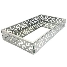 a metal tray with an intricate design on the bottom and sides, set against a white background