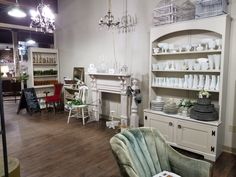 a living room filled with furniture and lots of white items in it's walls