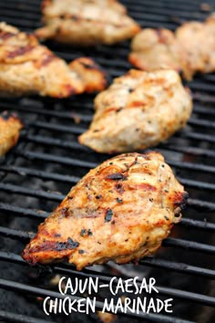 grilled chicken on the grill with text overlay that reads cajun - caesar chicken marinade