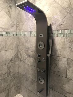 a shower head with blue lights on it