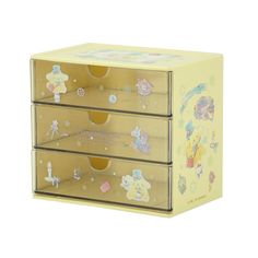 three drawers with cartoon stickers on the front and bottom, each drawer has an open lid