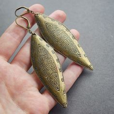 Bronze Shield Earrings: These stunning statement earrings are sure to turn heads wherever you go! Perfect for music festivals, boho photo shoots, Burning Man, or anywhere else you want to celebrate your bold sense of fashion. ✧ Just under 3.75 inches long ✧ Mid-weight design at ~10 grams each (same as 2 US nickels) ✧ Aged brass lever-back hooks for secure fit ✧ Hypoallergenic steel hooks or tunnel threaders on request ✧ Gift-ready in attractive, earth friendly box ✧ Handmade just for you, ready Vintage Festival Earrings With Ear Wire, Handmade Antique Gold Drop Earrings, Bronze Festival Earrings, Handmade Bohemian Antique Gold Earrings, Bronze Bohemian Earrings For Festivals, Handmade Bronze Teardrop Metal Earrings, Bohemian Brass Teardrop Earrings For Pierced Ears, Handmade Bronze Metal Teardrop Earrings, Bohemian Bronze Teardrop Earrings Gift