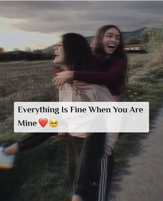 two girls hugging each other in the middle of a field with text that reads, everything is fine when you are mine