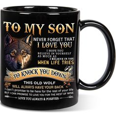 a black coffee mug with an image of a wolf on the front and words to my son