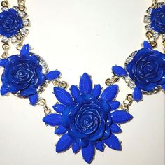 Nwt Royal Blue Floral Statement Necklace By Zad. This Necklace Is Adjustable Up To 20". There Are Seven Blue Roses, Grafuated In Size With The Largest Being 2" High. The Six Smaller Flowers Are Surrounded By Clear Rhinestones. The Chain & Backings On The Flowers Are Made Of Goldtone Metal. This Necklace Is In Excellent, Like New Condition. I Bought It, Never Wore It & Only Took It Out Of Its Original Packaging To Take The Photos. Offers Welcome Bundle & Save Elegant Blue Flower Shaped Necklace, Elegant Blue Flower-shaped Necklace, Elegant Blue Flower Necklace, Spinning Necklace, Fern Necklace, Royal Blue Flowers, Feather Pendant Necklace, Floral Statement Necklace, Beaded Bib Necklace