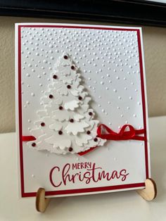 a christmas card with a white tree on it