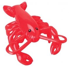 a red plastic crab toy on a white background