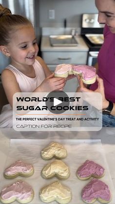 a woman and her daughter looking at some cookies